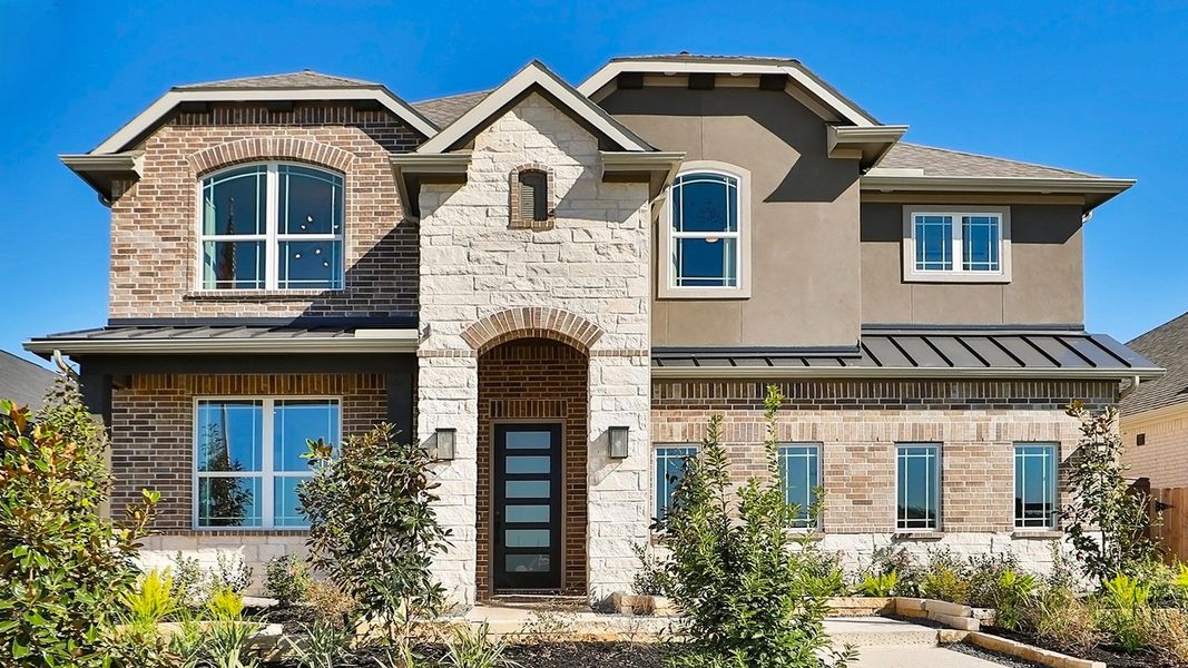 Exquisite brickwork and arched windows define this modern Brookewater residence. Exquisite brickwork and arched windows define this modern Brookewater residence.