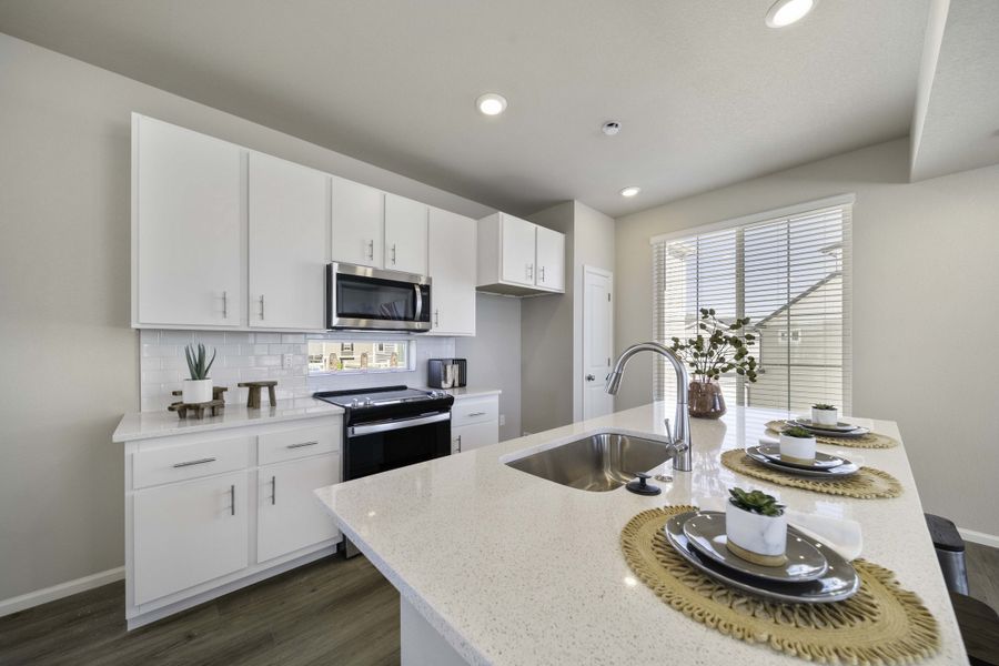 Furnished interior in a model home at Coach House at Green Valley Ranch in Aurora (Image 3).