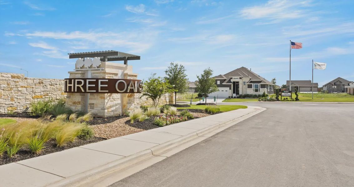 Entrance to the Village at Three Oaks community in Seguin, TX, featuring signage and landscaping (Image 13). Entrance to the Village at Three Oaks community in Seguin, TX, featuring signage and landscaping (Image 13).