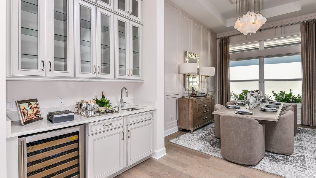 Furnished interior in a model home at Esplanade by the Islands in Naples (Image 60).