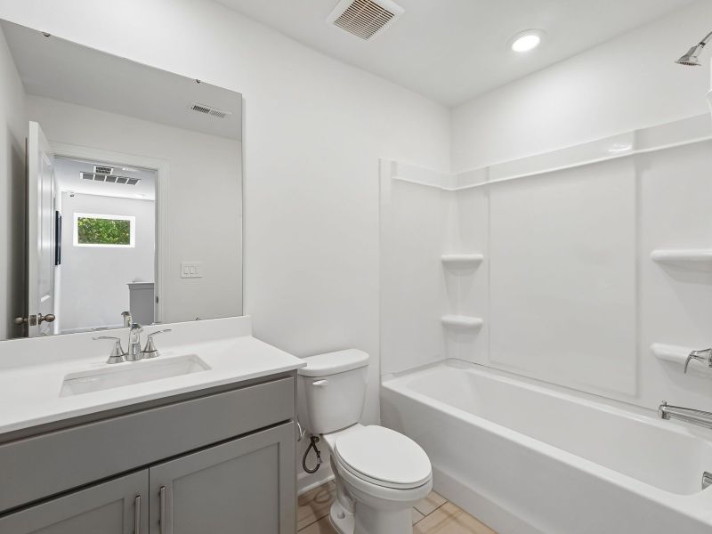 Furnished interior in a model home at Rocky River Towns in Charlotte (Image 17).