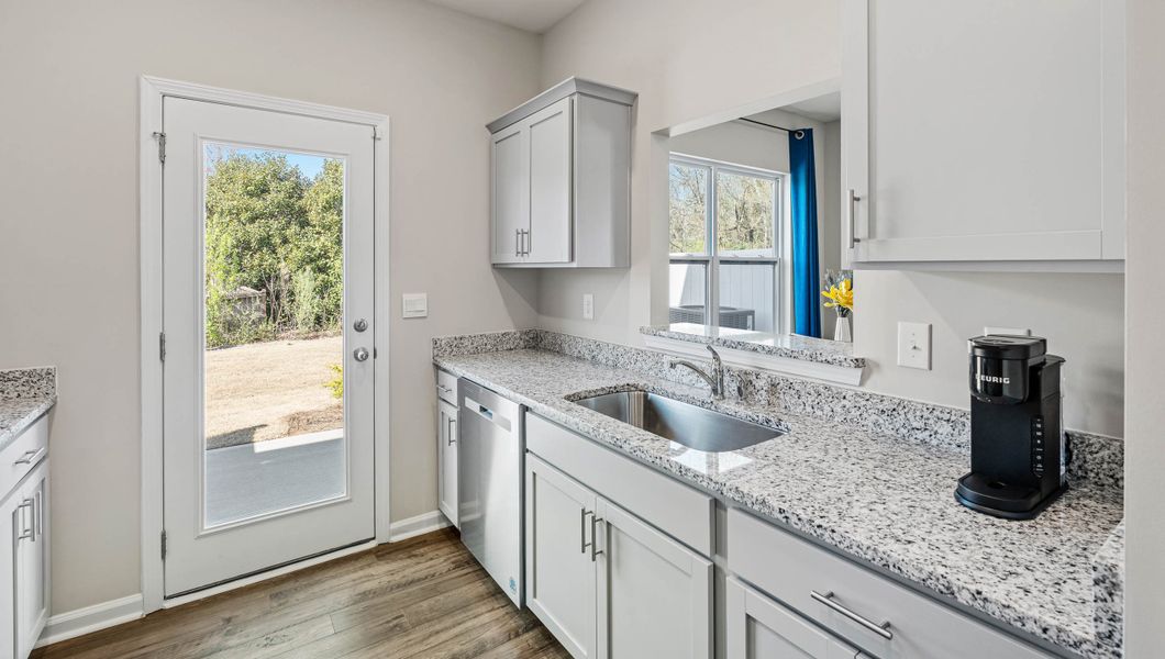 Furnished interior in a model home at Covington Village in Greer (Image 9).