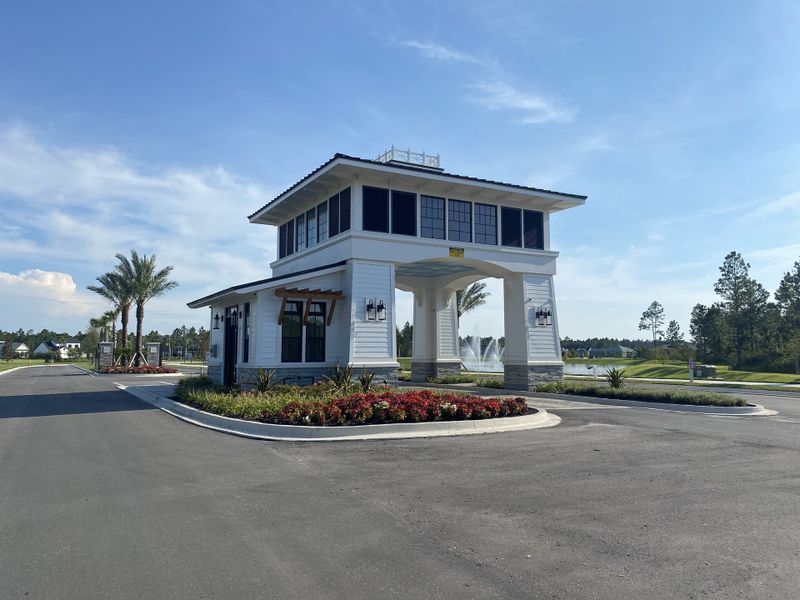 A charming community entrance with a landscaped garden in Del Webb Saint Johns by Del Webb (St. Johns, FL).