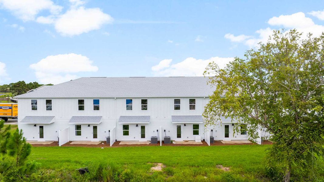Front exterior of a home in the Caballeros Estates Townhomes at Hombre community, located in Panama City Beach, FL (Image 10).