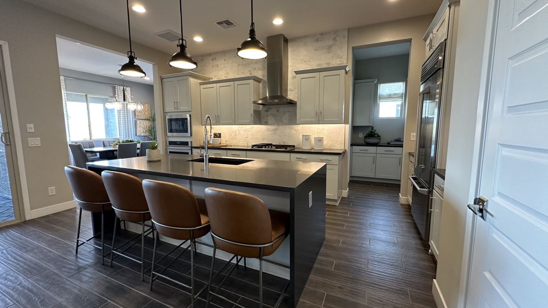 Furnished interior in a model home at CantaMia at Estrella 55+ in Goodyear (Image 9).