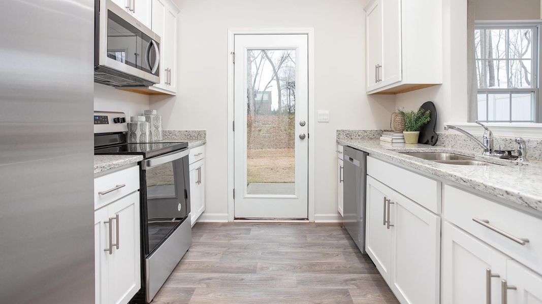 Furnished interior in a model home at The Townes at Riley's Meadow in Haw River (Image 7).
