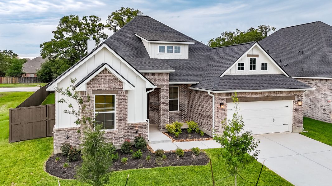 Front exterior of a home in the Oakmont community, located in Bryan, TX (Image 11).