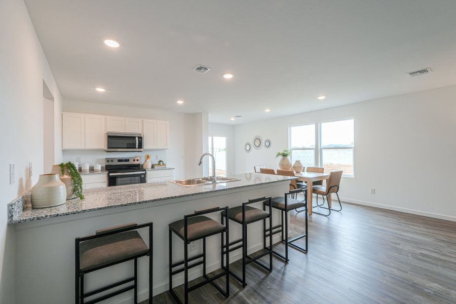 A kitchen with a marble island. A kitchen with a marble island.