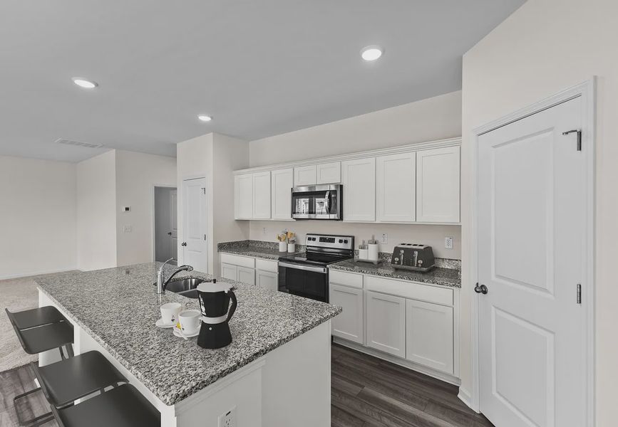 Furnished interior in a model home at Green Hill in Louisburg (Image 6).