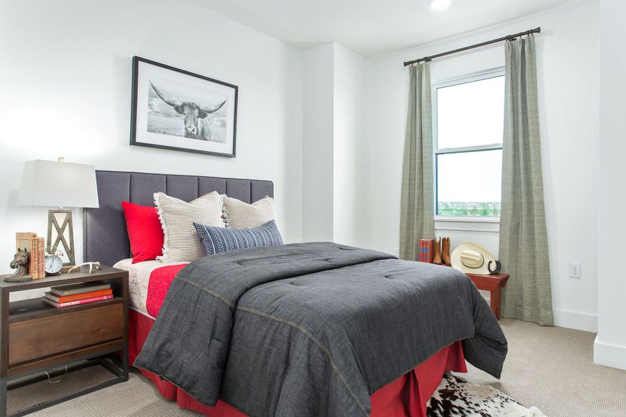 Furnished interior in a model home at Windsong Ranch Townhomes in Prosper (Image 25).