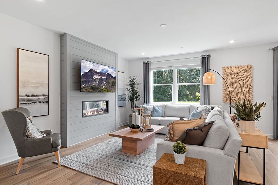 A living room with a couch and a coffee table. A living room with a couch and a coffee table.