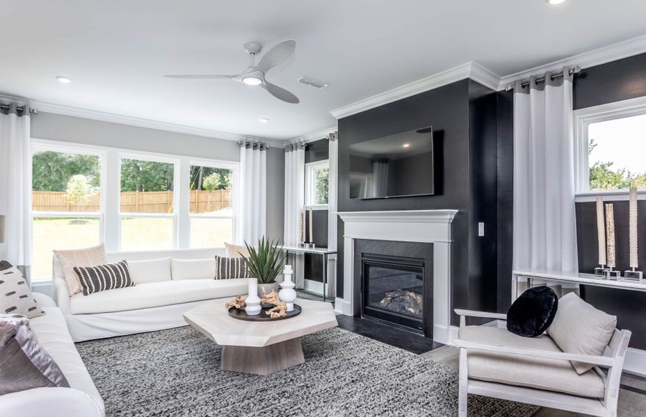 Cozy Fireplace & Large Windows Make the Perfect Gathering Space