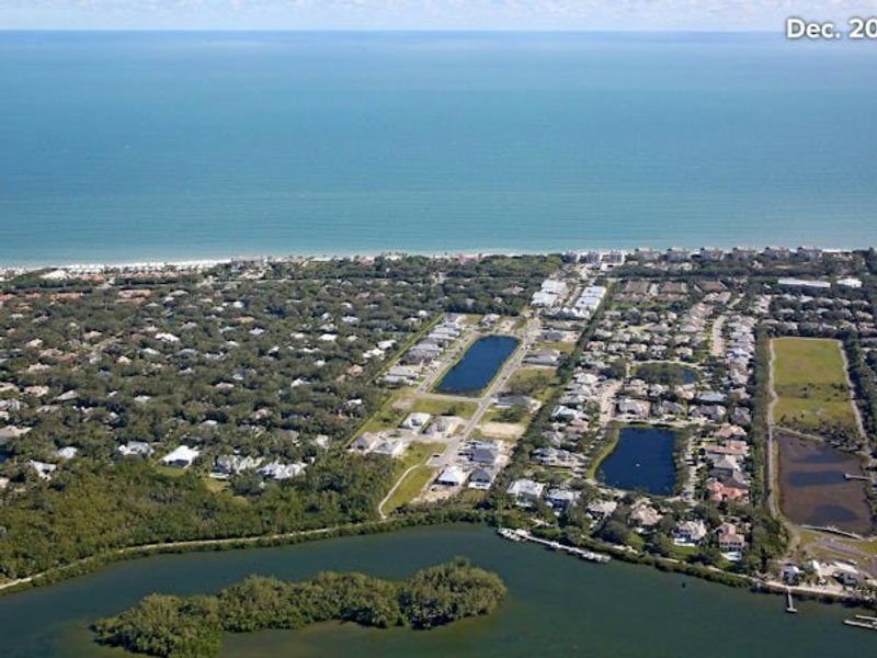 Aerial view of the The Strand community in Vero Beach, FL, showing layout and nearby surroundings (Image 21).