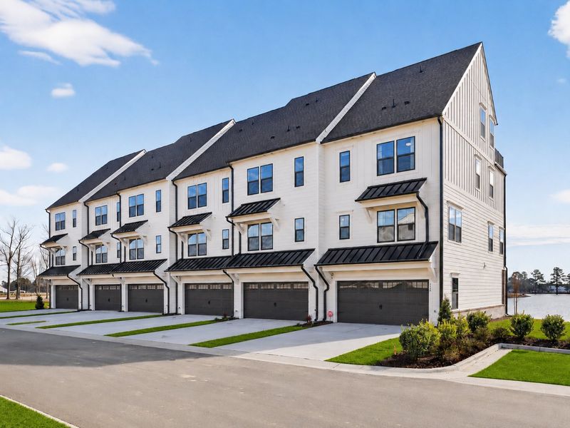Front exterior of a home in the North District at Flowers Plantation Townhomes community, located in Clayton, NC (Image 2).