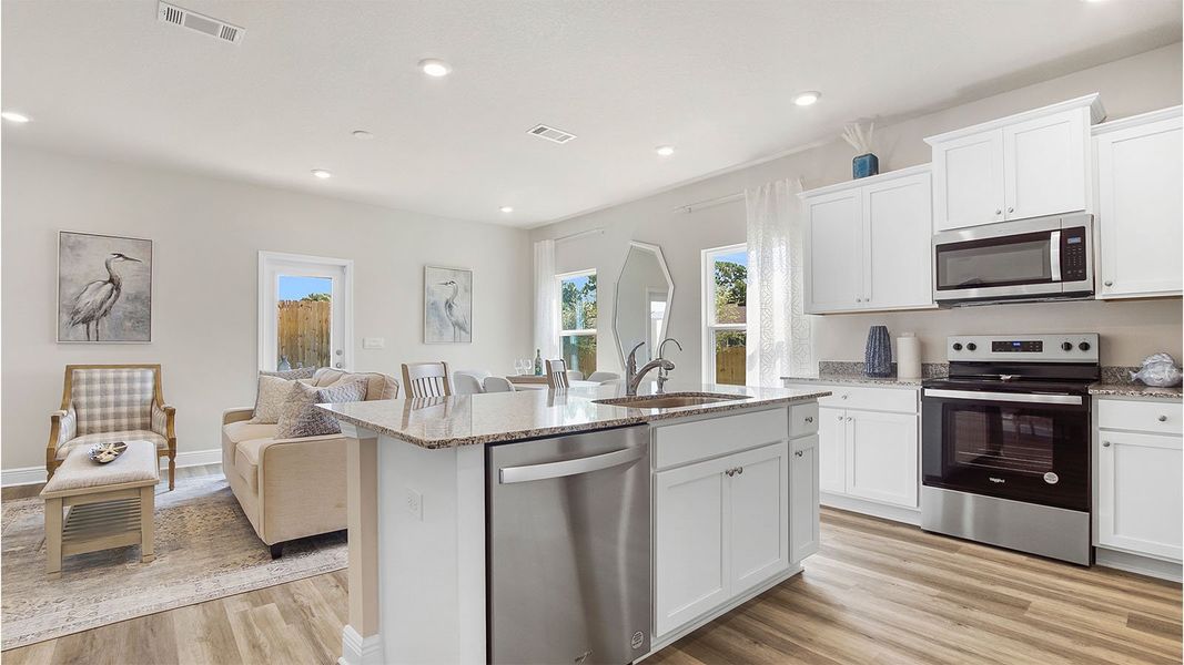 Furnished interior in a model home at Caballeros Estates Townhomes at Hombre in Panama City Beach (Image 5).