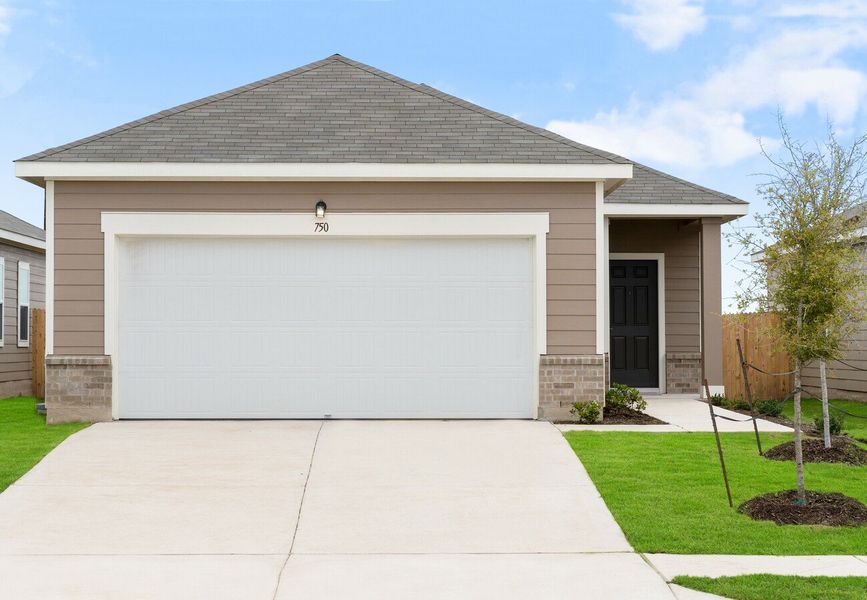 Front exterior of a home in the Stonebrooke community, located in Conroe, TX (Image 2).