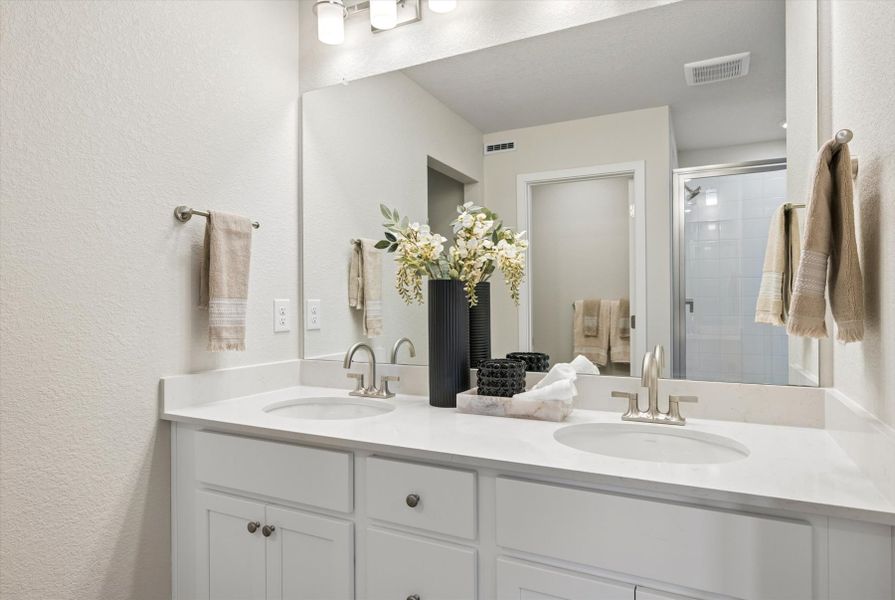 A bathroom with a large mirror. A bathroom with a large mirror.