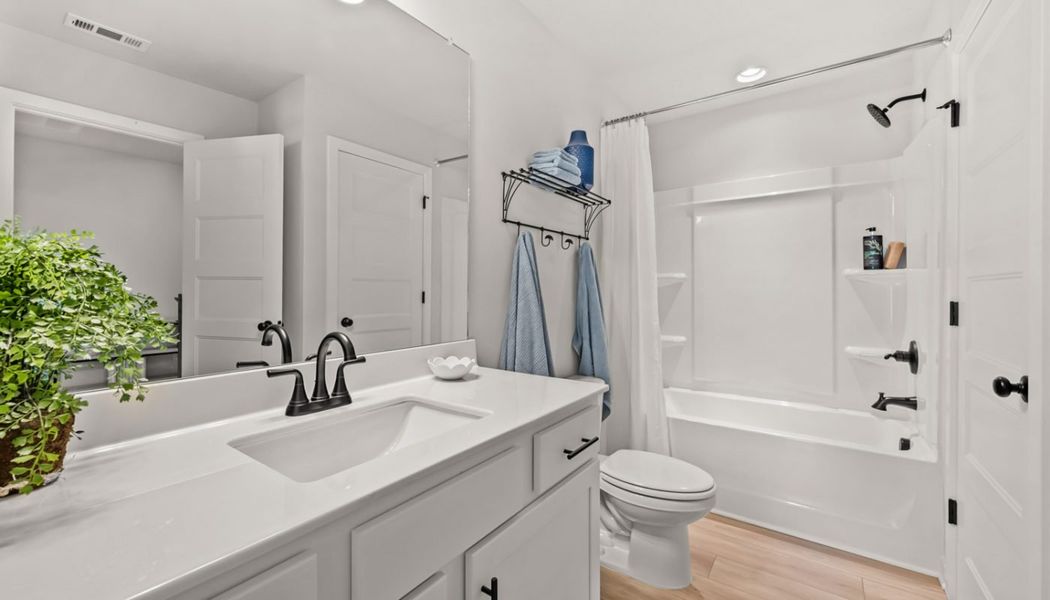 Furnished interior in a model home at Rosewood Lake Preserve in Hoschton (Image 7).