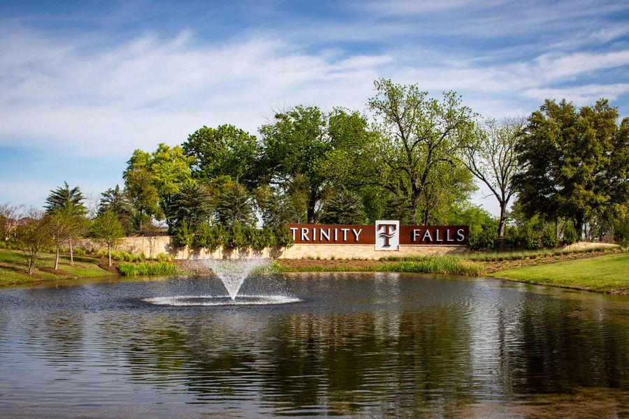 Entrance to the Trinity Falls community in McKinney, TX, featuring signage and landscaping (Image 2).
