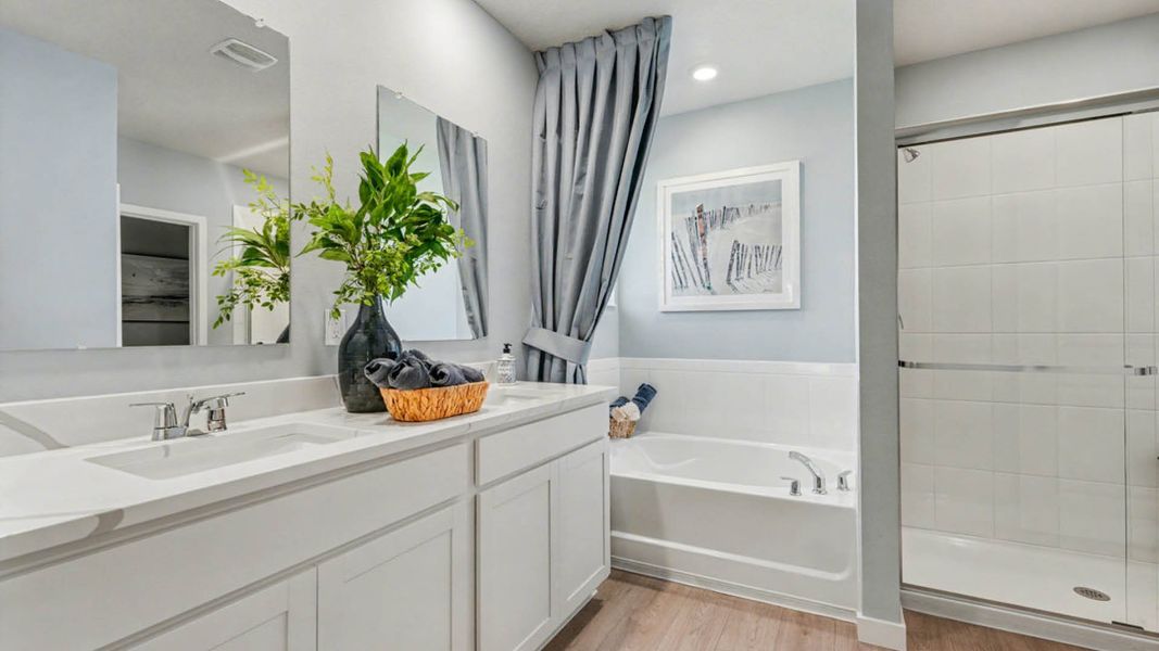 Furnished interior in a model home at Indian River Preserve in Mims (Image 19).