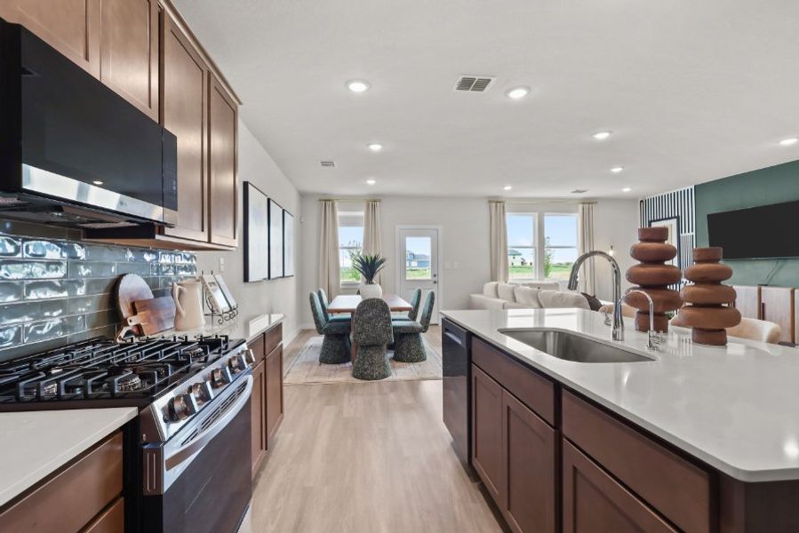 A person in a kitchen. A person in a kitchen.