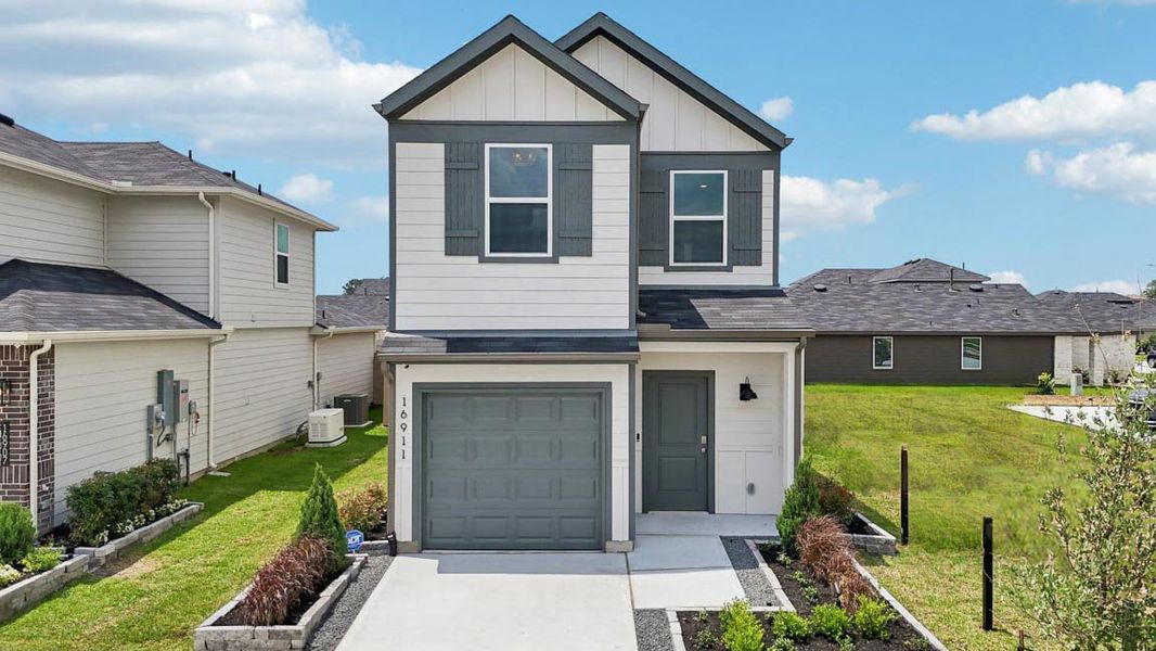 Front exterior of a home in the The Villas at Legacy Park community, located in Houston, TX (Image 1).