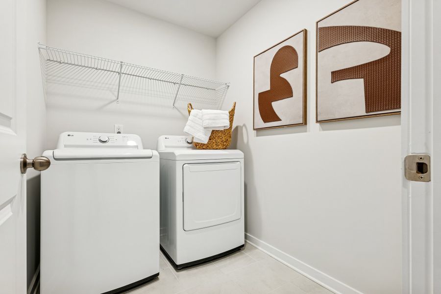 A laundry room with a washer and dryer. A laundry room with a washer and dryer.