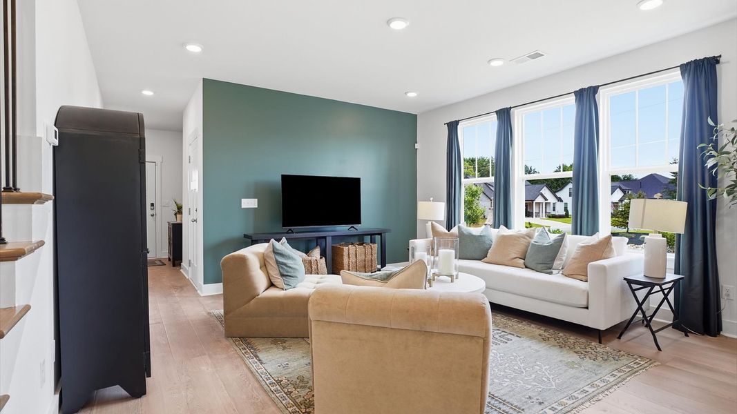Exceptional family space with hardwood floors and seamless flow to dining and kitchen areas at Anna's Pointe