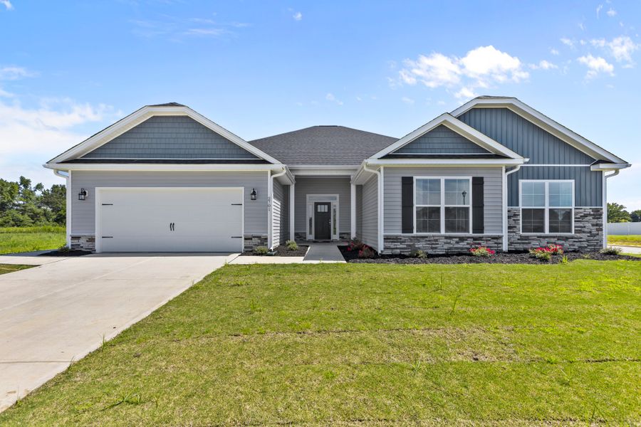 Front exterior of a home in the Windfield community, located in Grimesland, NC (Image 1).