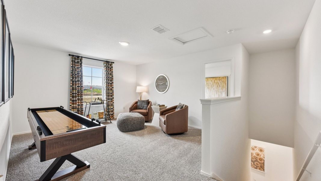 Furnished interior in a model home at Palomino in Manor (Image 34).