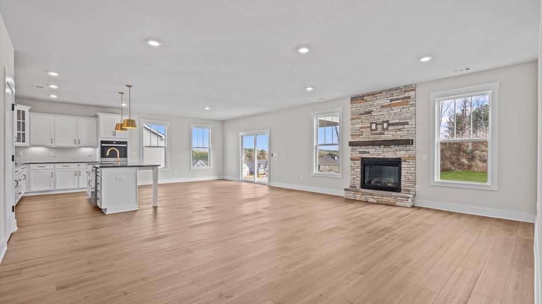 Family room with vaulted ceilings, and fireplace
