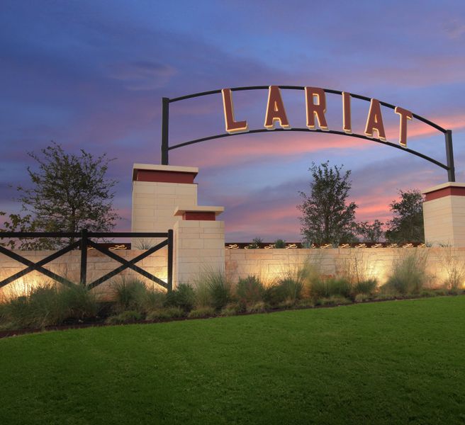 Entrance to the Lariat community in Liberty Hill, TX, featuring signage and landscaping (Image 4).
