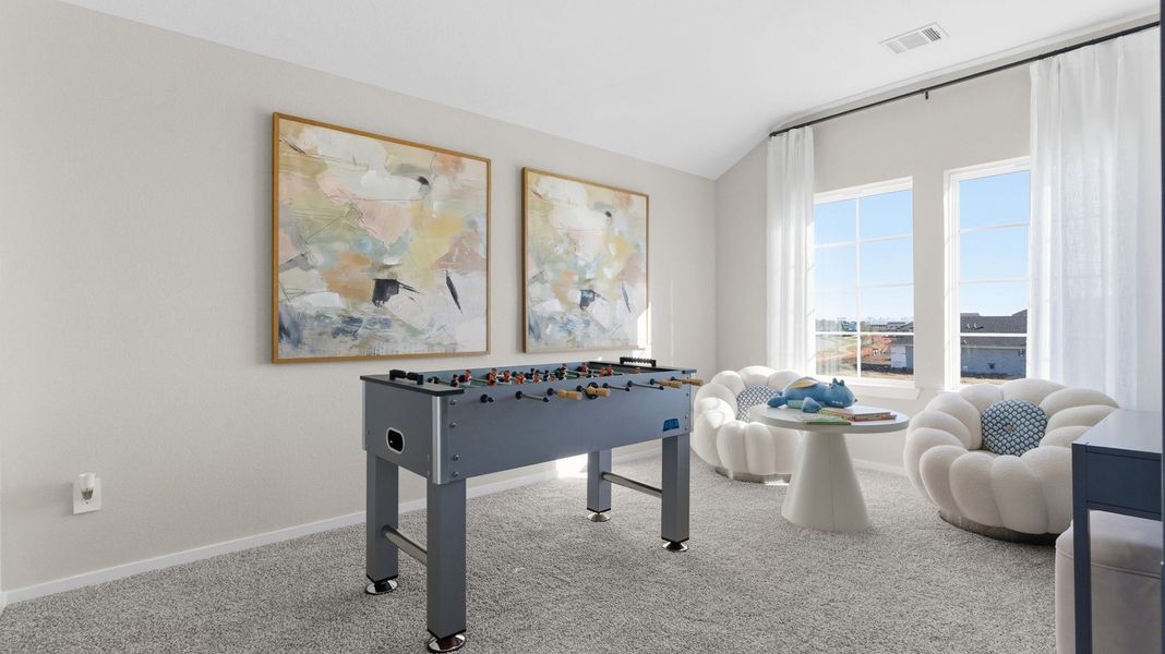 Furnished interior in a model home at Caldwell Crossing in Iowa Colony (Image 20).