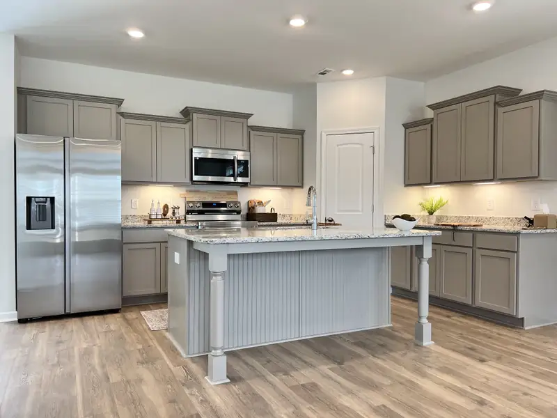 All kitchen appliances included! Note the side by side stainless steel refrigerator