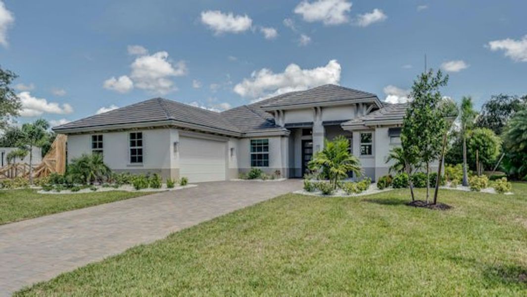 Front exterior of a home in the Bent Pine Preserve community, located in Vero Beach, FL (Image 6).