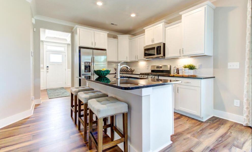 Furnished interior in a model home at CraigStone in Woodruff (Image 6).