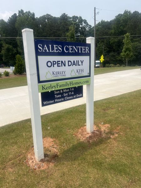 Sales center sign for Kerley Family Homes at The Overlook at Factory Shoals in Mableton, GA. Large trees in the background. Sales center sign for Kerley Family Homes at The Overlook at Factory Shoals in Mableton, GA. Large trees in the background.