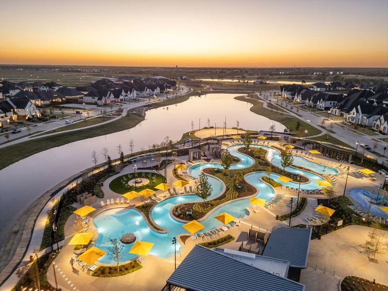 Aerial of volleyball court, lazy river and lake in Mosaic, Celina, Texas