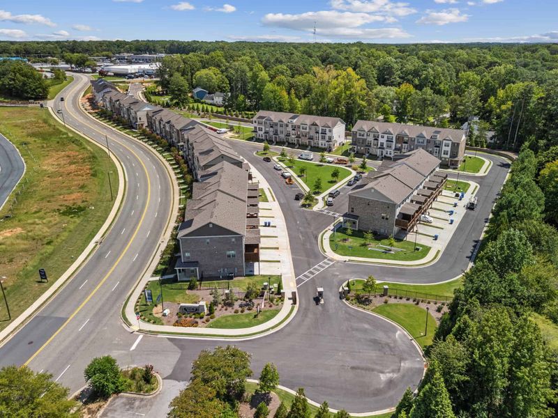 Aerial view of the Towns at Enclave community in Lawrenceville, GA, showing layout and nearby surroundings (Image 12). Aerial view of the Towns at Enclave community in Lawrenceville, GA, showing layout and nearby surroundings (Image 12).