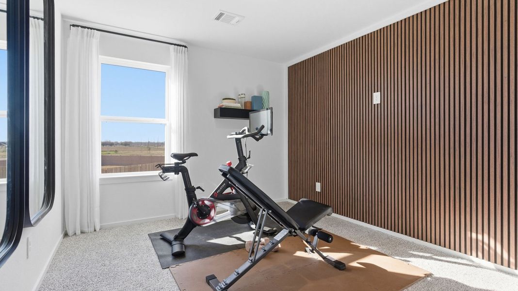 Furnished interior in a model home at Caldwell Crossing in Iowa Colony (Image 21).