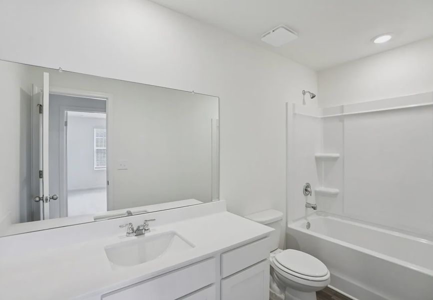 Furnished interior in a model home at Ashland in Angleton (Image 7).