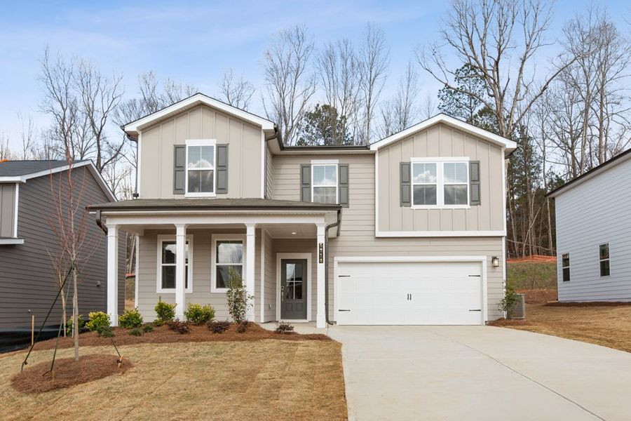 A white house with a garage. A white house with a garage.