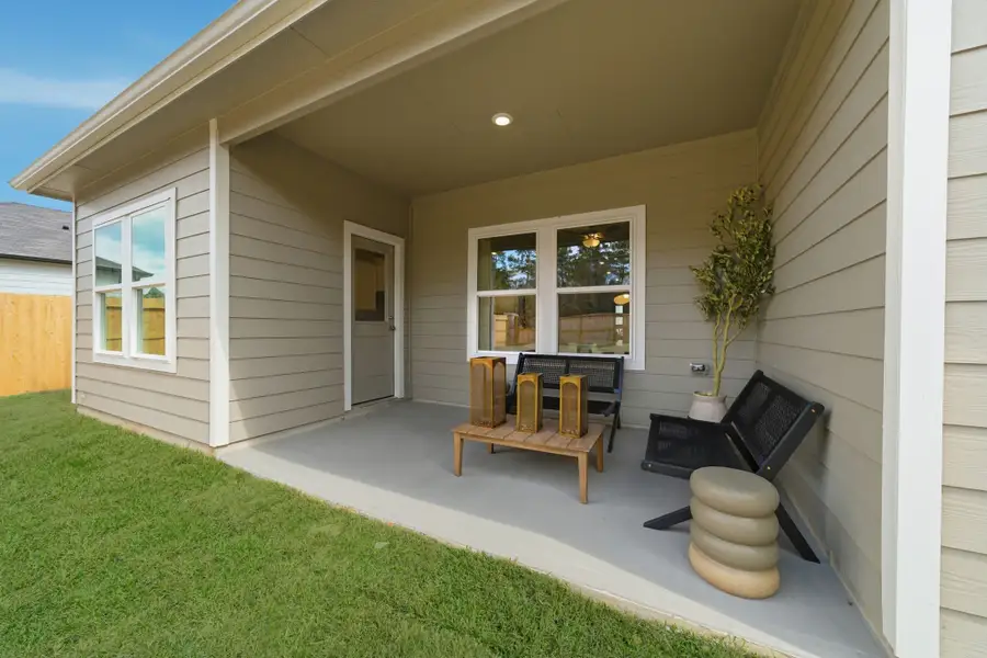 A house with a green lawn.