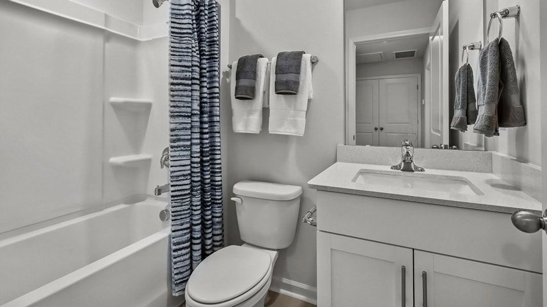 Furnished interior in a model home at The Townes at Prestleigh in Wake Forest (Image 31).