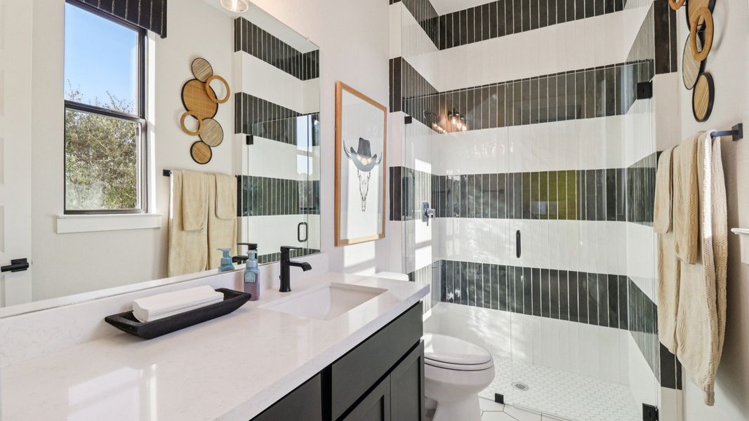 Elegantly designed striped tile shower with natural lighting enhances this sophisticated Verandas at the Rim bathroom. Elegantly designed striped tile shower with natural lighting enhances this sophisticated Verandas at the Rim bathroom.