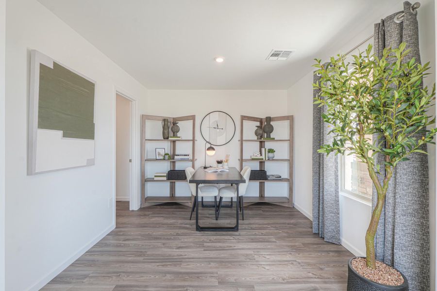 A room with a table and shelves. A room with a table and shelves.