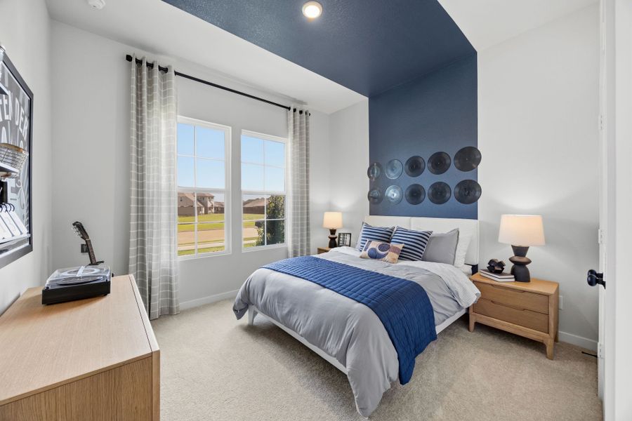 A bedroom with a bed and a window. A bedroom with a bed and a window.