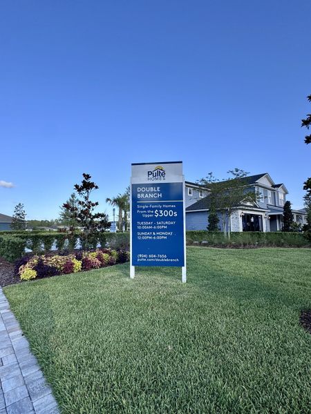 Beautifully manicured lawns surround this appealing sign in Double Branch by Pulte Homes in Middleburg, FL.