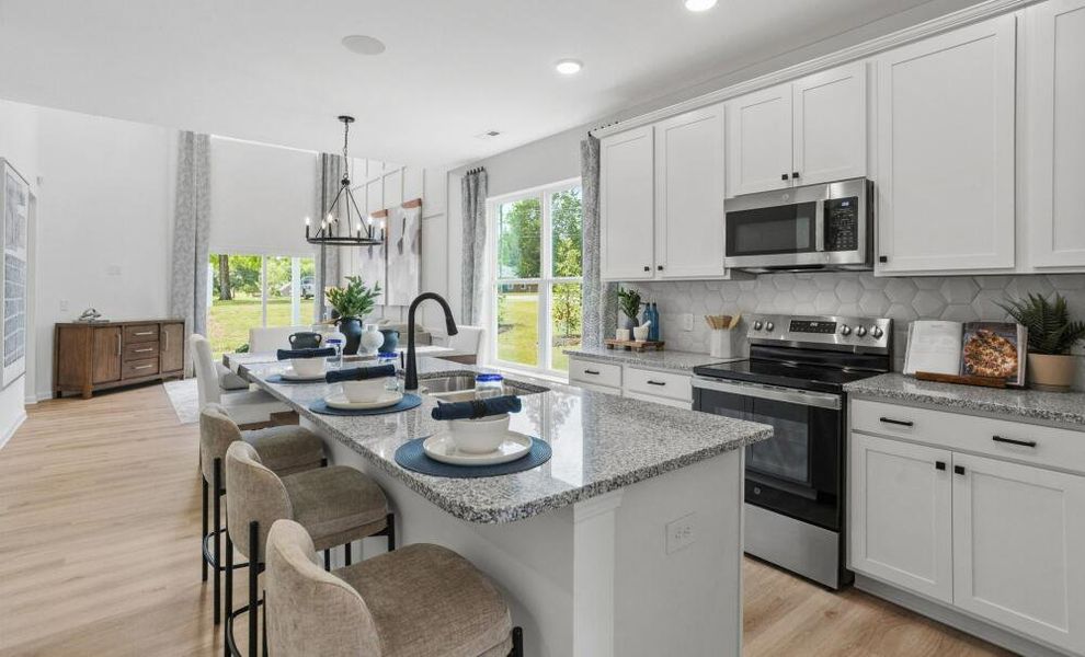 Furnished interior in a model home at CraigStone in Woodruff (Image 5).