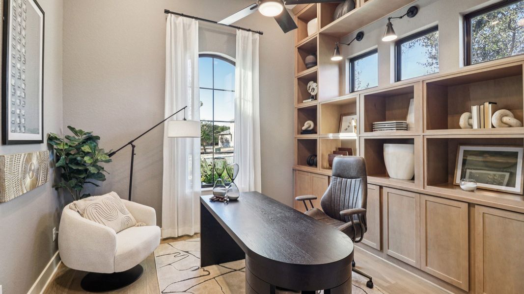 Custom wood shelving and expansive windows elevate this San Antonio office's refined design in Verandas at the Rim. Custom wood shelving and expansive windows elevate this San Antonio office's refined design in Verandas at the Rim.